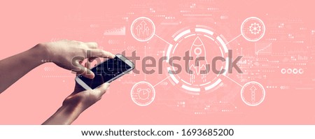 Rapid growth concept with person holding a white smartphone