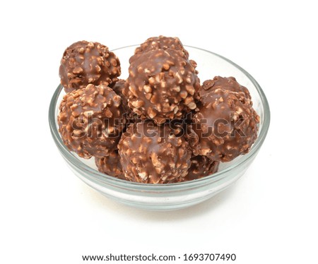 Chocolate candies collection. Beautiful Belgian truffles isolated in glass bowl on white background