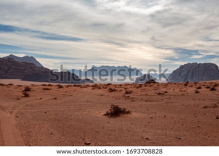 Wadi Rum desert and mountains. Wadi Rum known also as the Valley of the Moon is a valley cut into the sandstone and granite rock in southern Jordan