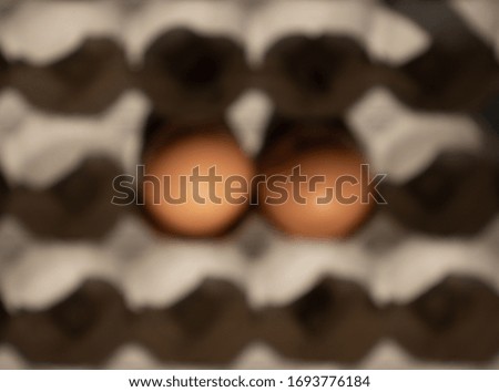 Blured picture of  a carton of eggs