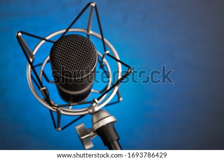 Podcast Microphone on colored background