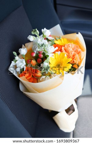 Bouquet for gifts in the passenger seat