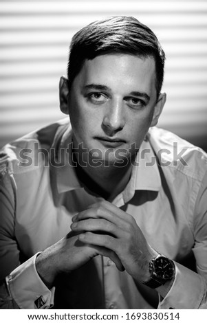 Black white portrait of handsome successful young man