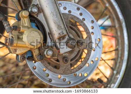 Old gold motorbike brake near to break down