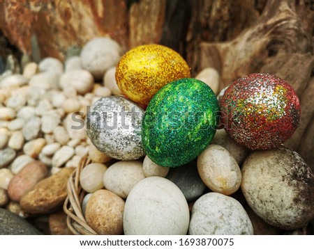 Easter and spring background with Easter eggs and stone garden background