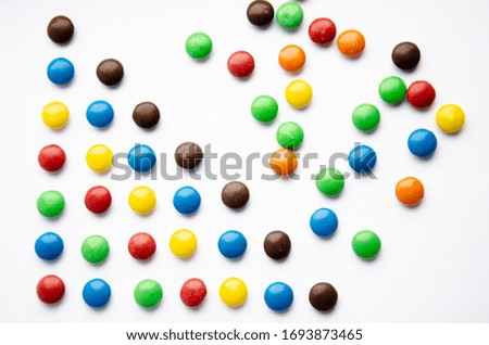bright colored balls. The background is colorful.