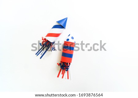 Diy 4th of July decor color American flag. Patriotic holiday. Process kid children craft. Rocket with fireworks Royalty-Free Stock Photo #1693876564