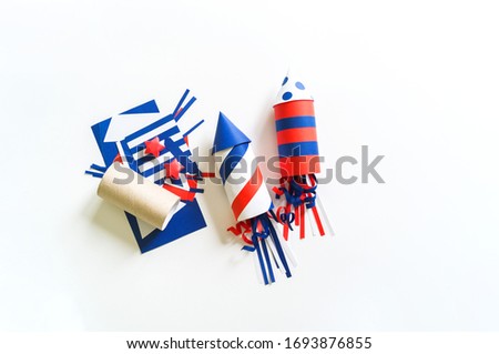 Diy 4th of July decor color American flag. Patriotic holiday. Process kid children craft. Rocket with fireworks Royalty-Free Stock Photo #1693876855