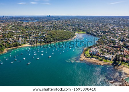 Aerial view on Reef Bay, Sydney, Australia. View on Sydney harbourside suburb from above. Aerial view on Forty Baskets Beach, Reef Bay and Sydney in the background.