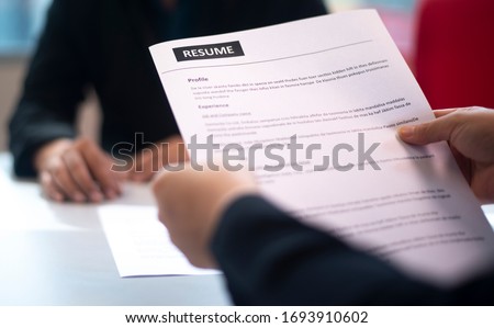 Recruitment, contract and business  employment concept. HR review the profile resume of the job applicant. Business employment and human resource management concept. Royalty-Free Stock Photo #1693910602