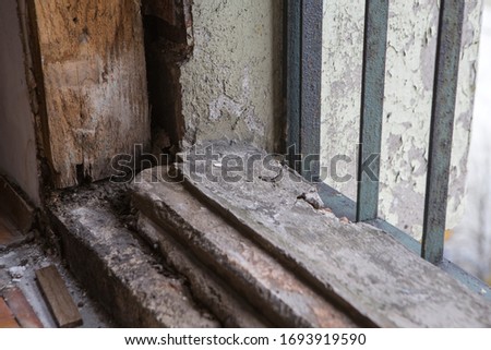 Old ruined wooden flooring, house refurbishing or renovation process, detail closeup of aged and weathered 