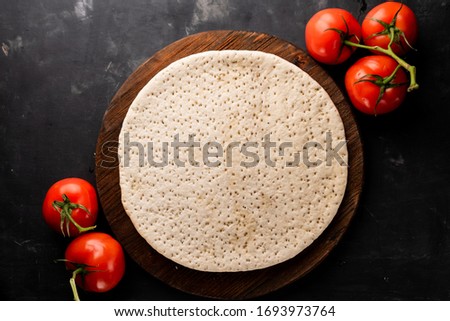 prepared pizza crust from pizzeria
