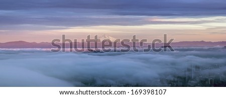 Portland Oregon Downtown Covered in Fog at Sunset with Mount Hood Panorama