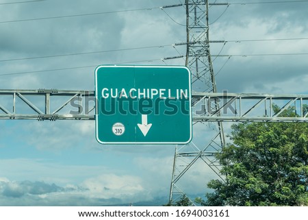 Road sign that says Guachipelin. One of the many locations in Costa Rica. Costa Rica roads. South America.