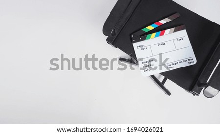 Clapper board or or movie slate with director chair.It put on white background.