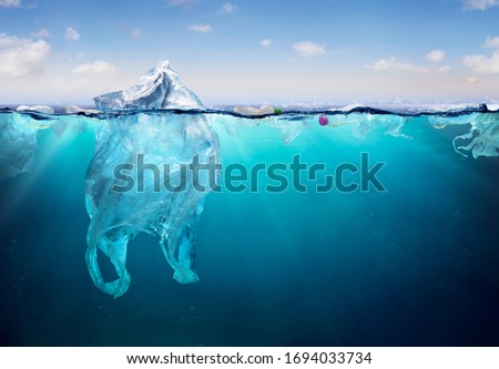 Plastic Pollution In Ocean - Plastic Bag Floating On Sea - Environmental Problem
 Royalty-Free Stock Photo #1694033734