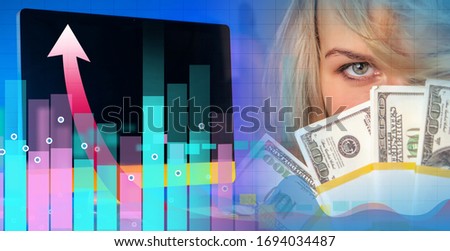 Revenue growth from remote work.The girl demonstrates the money earned. Successful investment. Increased revenue from e-Commerce.Girl with money in her hands on the background of a computer and charts