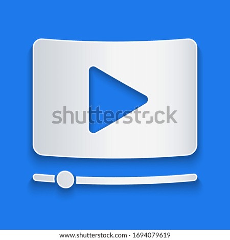 Paper cut Online play video icon isolated on blue background. Film strip with play sign. Paper art style. Vector Illustration