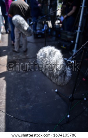 Professional boom microphone on a television set during live broadcast