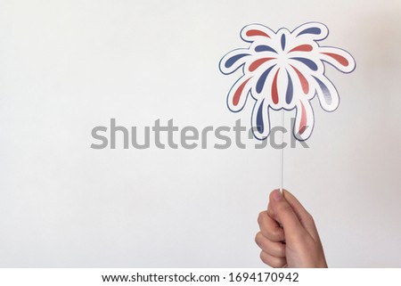 Woman hand holding fireworks props . USA holiday, 4 of July, celebration concept. With copy space