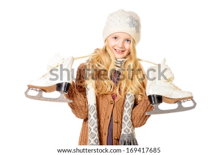 Pretty ten years girl standing with figure skates. Isolated over white.