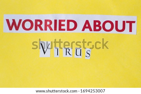 worried about virus inscription cut out on a yellow background, red letters
