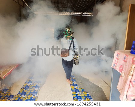Mosquito repellent spraying staff In a dangerous area
