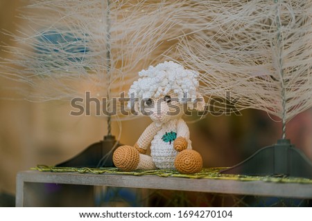 The cute handmade crochet sheep.
