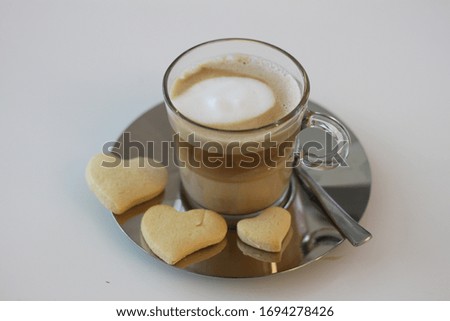delicious cappuccino with butter pastes isolated on white background