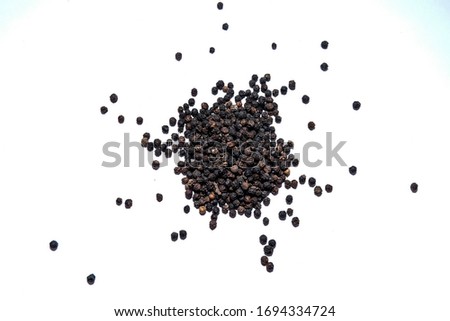 black peper on white background Royalty-Free Stock Photo #1694334724