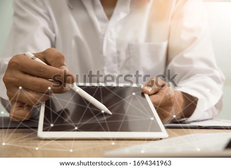 businessman working with business documents on office table with digital tablet computer