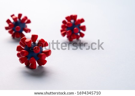 Plasticine model  of coronavirus bacteria 
or  other virus  on blue background. Place fo text
 Royalty-Free Stock Photo #1694345710