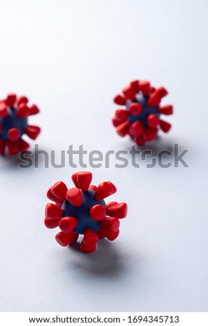 Plasticine model  of coronavirus bacteria 
or  other virus  on blue background. Place fo text
 Royalty-Free Stock Photo #1694345713