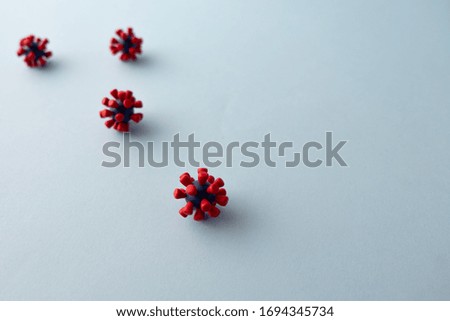 Plasticine model  of coronavirus bacteria 
or  other virus  on blue background. Place fo text
 Royalty-Free Stock Photo #1694345734