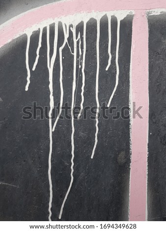 Pink stripes on a black background. Smudges of paint gently flow down on a surface. Geometry \/ Asymmetric pattern.