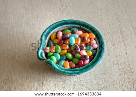Bowl of Rainbow colored jellybeans for an Easter background.