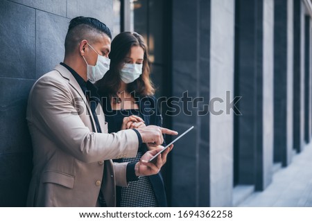 business worker with mask, businessman talking together with partner for marketing plan, coronavirus COVID-19 protection concept, new normal lifestyle Royalty-Free Stock Photo #1694362258
