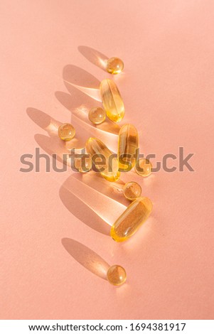 Pills on paper background advertising picture vitamins