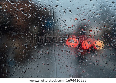 Rain on glass at bustop