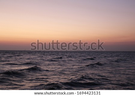 A picture of the twilight period during the sunset at the sea/ocean/lake can be used  for background 
