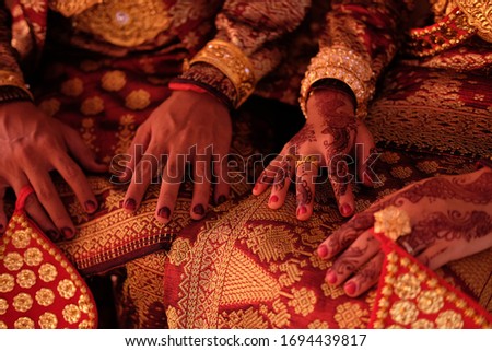 henna is a traditional ritual in Indonesia where the bride will decorate the palms of her hands or legs before the marriage contract
