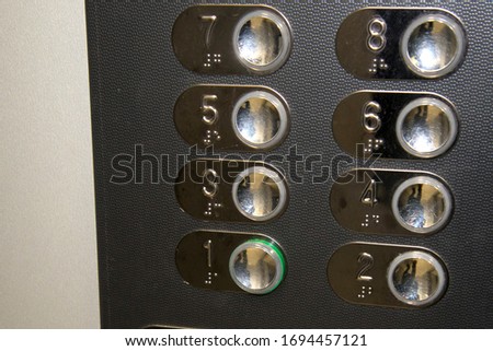 Viral infection is transmitted through objects. Coronavirus is transmitted through common objects. Viral infection on the buttons of the elevator. Precautions and disease prevention.