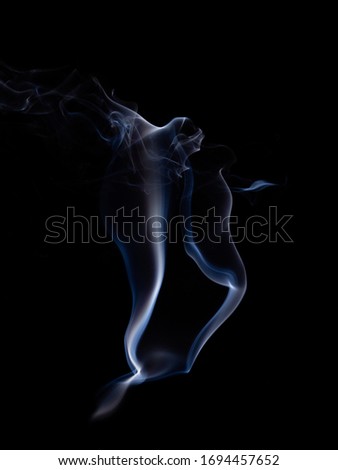 The swaying of smoke on a black background, Smoke shaped like a spirit
