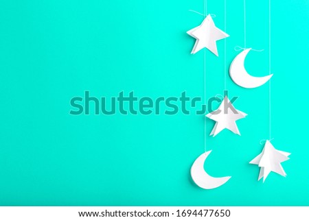 Mint background with new moon, stars of paper, handmade, free space for your text