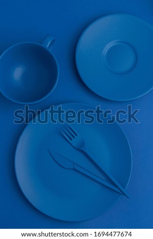 blue background with blue utensils, top view, nobody, color of the year, vertical