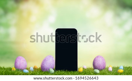 Easter banner with smart phone with blank screen among easter multi-colored decorated eggs. Mobile App Template