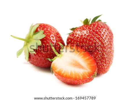 Two and half strawberries. Isolated on a white background.