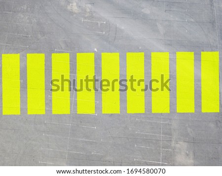 abstract top view of the sphalt texture and the crosswalk or pedestrian path print on the road 