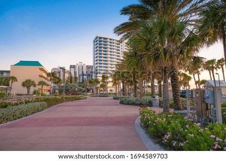 Clearwater Beach Florida. Boardwalk along the Gulf of Mexico. Hotels lit by the sunset light. Spring or summer vacations. Picture or photo good for travel agency. 
