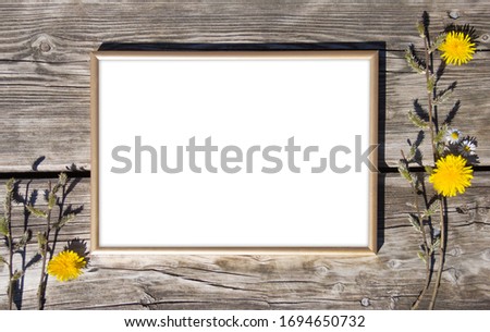 Gold photo frame on brown wood background